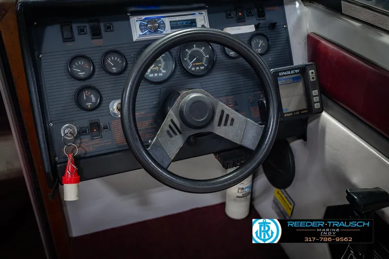 Slide: The Image of 1986 Regal Sebring 195 dashboard with steering wheel and gauges, featuring Eagle Fish ID system. - 29