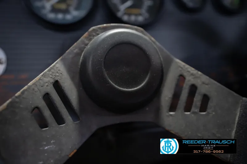 Slide: The Image of Close-up of a 1986 Regal Sebring 195 steering wheel with dashboard gauges. - 30