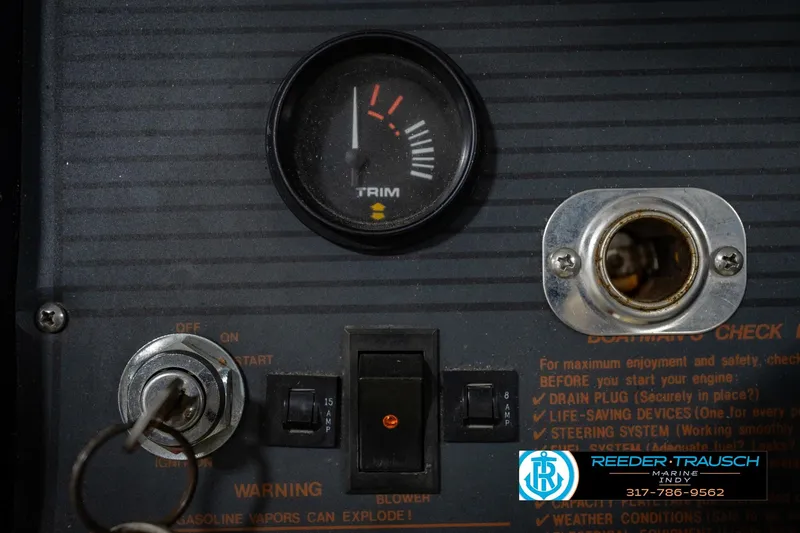 Slide: The Image of Dashboard of a 1986 Regal Sebring 195 boat with trim gauge and ignition switch. - 32
