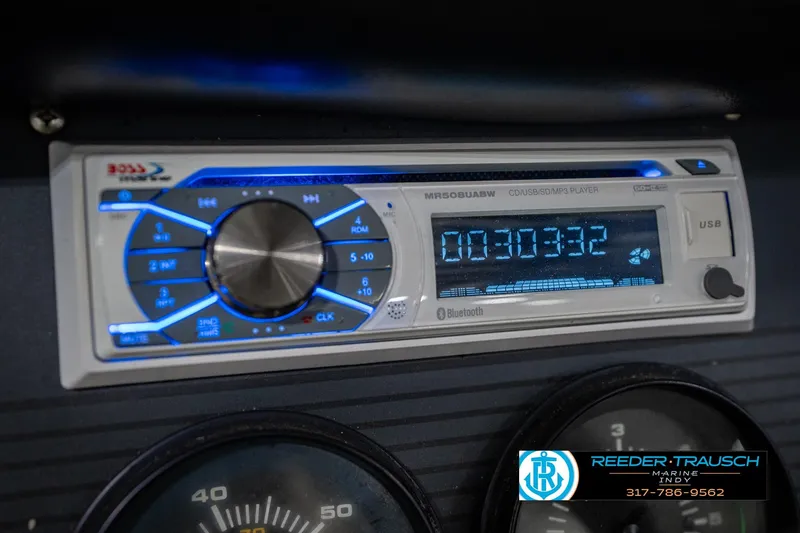 Slide: The Image of 1986 Regal Sebring 195 dashboard with modern Bluetooth stereo system. - 34