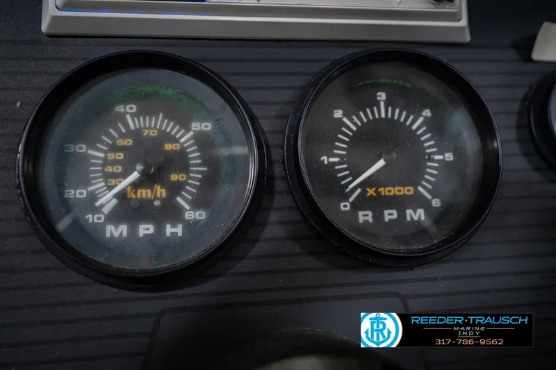 Slide: The Image of Dashboard gauges of a 1986 Regal Sebring 195 boat, showing speed and RPM. - 35