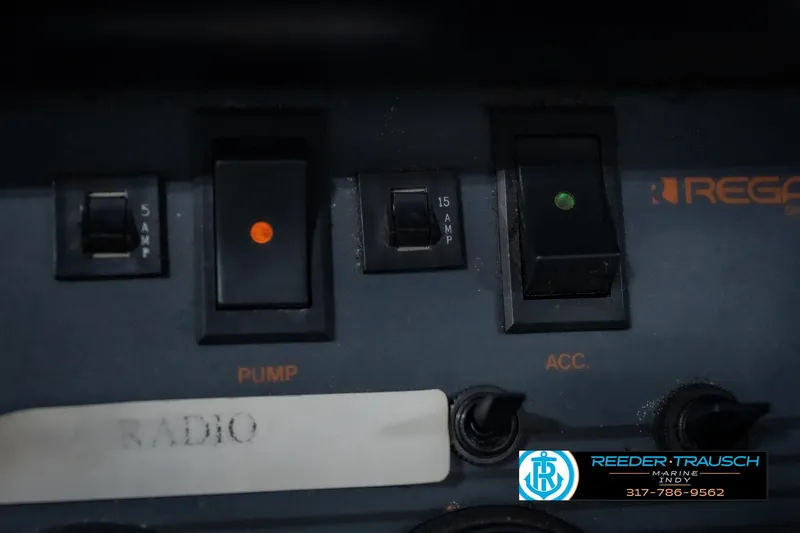 Slide: The Image of Control panel of a 1986 Regal Sebring 195 boat with switches and indicators. - 36