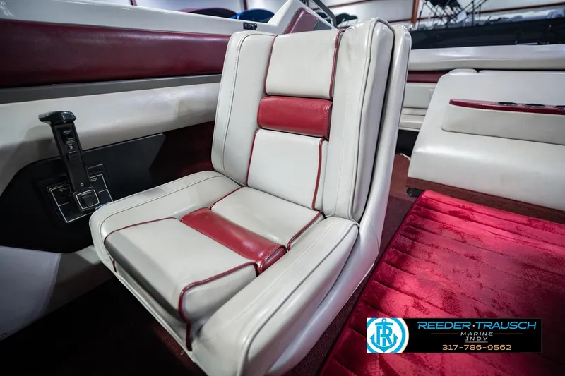 Slide: The Image of Interior of a 1986 Regal Sebring 195 boat with red and white seating. - 39