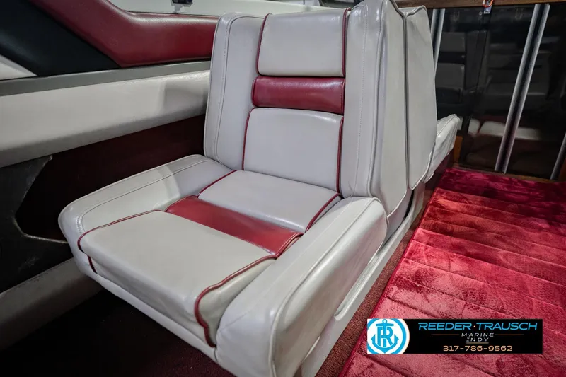 Slide: The Image of Red and white leather seat in 1986 Regal Sebring 195 boat interior. - 40