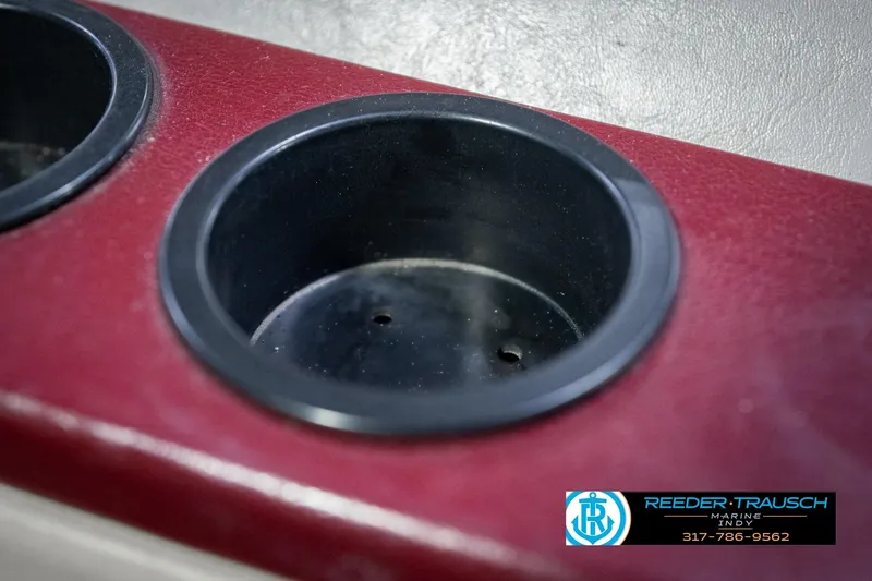 Slide: The Image of Cup holder in a 1986 Regal Sebring 195 boat, maroon interior detail. - 43