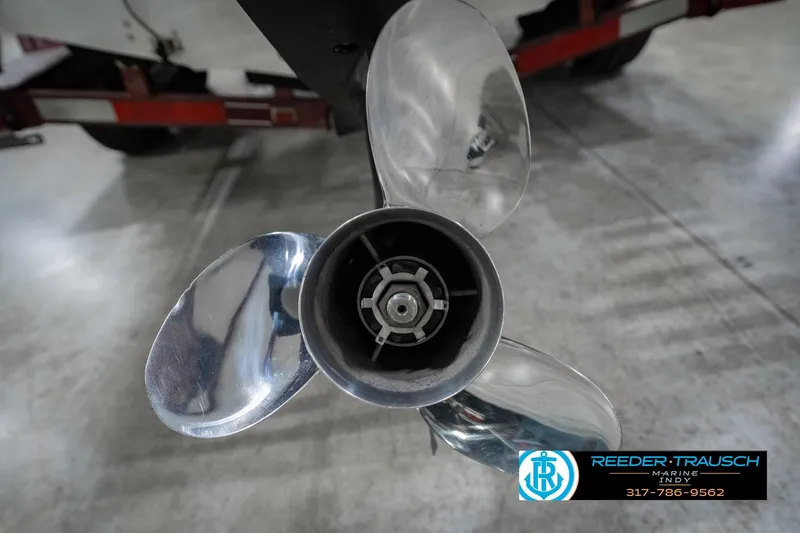 Slide: The Image of Close-up of a Regal Sebring 195 boat propeller, 1986 model, in a garage setting. - 48