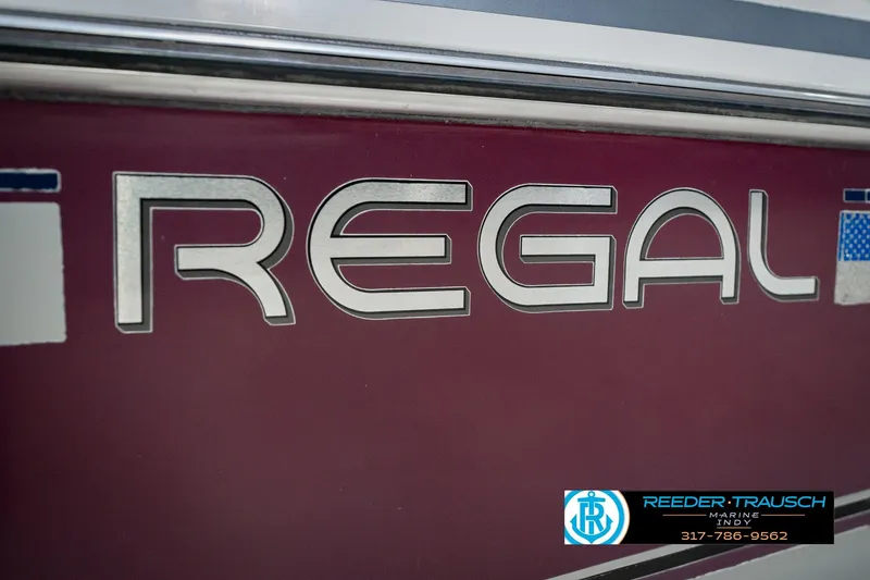 Slide: The Image of 1986 Regal Sebring 195 boat logo with Reeder Trausch Marine contact details. - 49