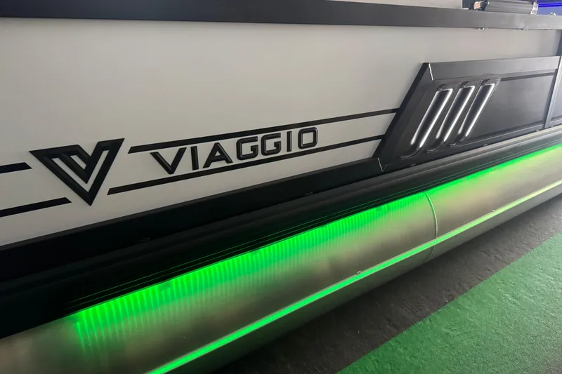 Slide: The Image of 2026 Viaggio Diamante 22UW boat with sleek design and green LED lighting. - 2