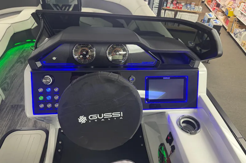 Slide: The Image of 2026 Viaggio Diamante 22UW boat dashboard with illuminated controls and Gussi Italia steering wheel. - 8