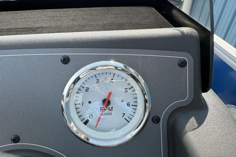 Slide: The Image of Tachometer on 2026 Sun Tracker Party Barge 16 DLX dashboard, showing RPM gauge. - 10