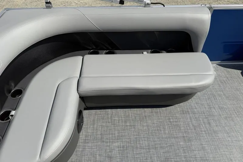 Slide: The Image of 2026 Sun Tracker Party Barge 16 DLX interior seating with cup holders. - 13
