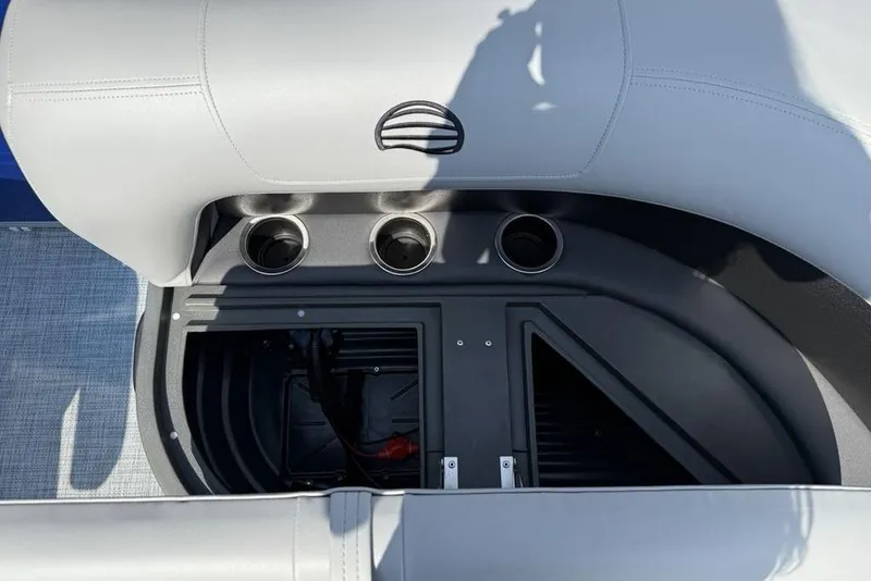 Slide: The Image of Interior view of 2026 Sun Tracker Party Barge 16 DLX with cup holders and storage compartment. - 7