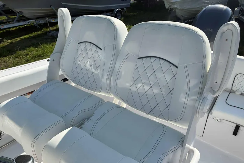 Slide: The Image of 2023 Sportsman Heritage 231 Center Console boat seats with diamond stitching design. - 5
