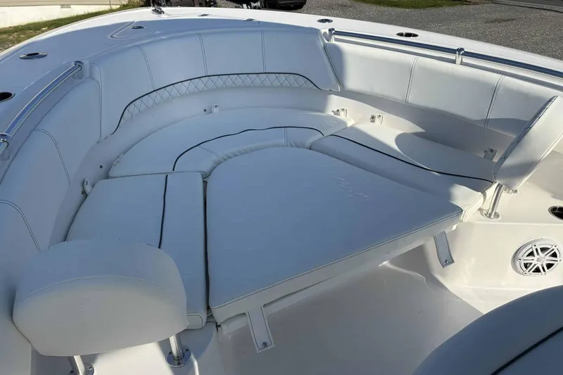 Slide: The Image of 2023 Sportsman Heritage 231 Center Console boat with spacious white seating area. - 6