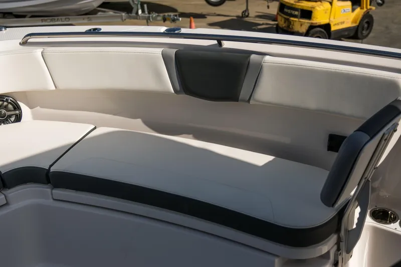 Slide: The Image of 2025 Robalo R300 Center Console boat seating area with cushioned seats and speaker. - 11