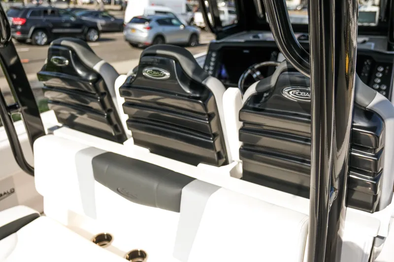 Slide: The Image of 2025 Robalo R300 Center Console boat seats, sleek black and white design. - 13