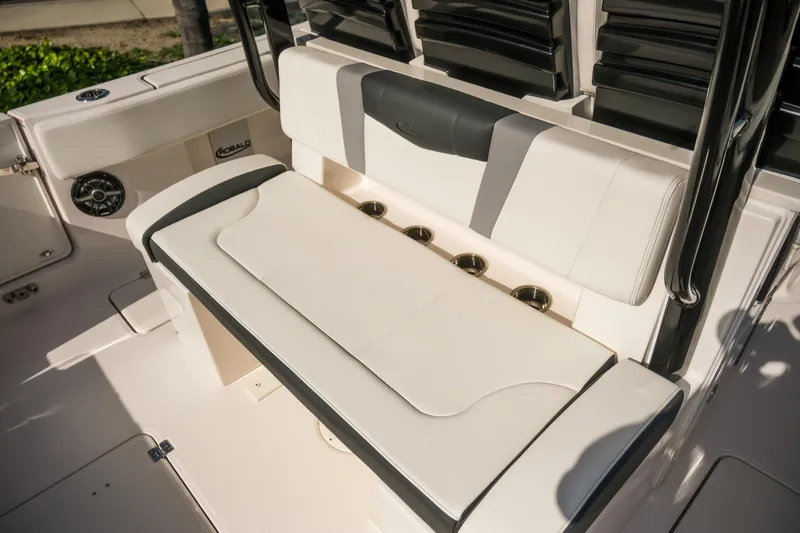 Slide: The Image of 2025 Robalo R300 Center Console boat seating with cup holders and sleek design. - 14