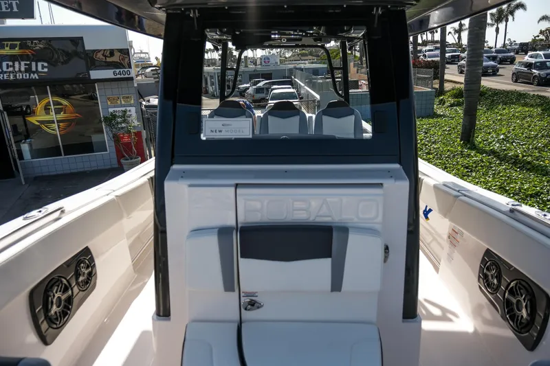 Slide: The Image of 2025 Robalo R300 Center Console boat interior with seating and speakers. - 4