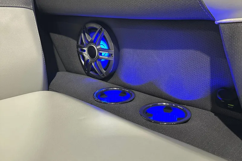 Slide: The Image of Interior of 2026 Viaggio Lago X22U with illuminated speaker and cup holders. - 13