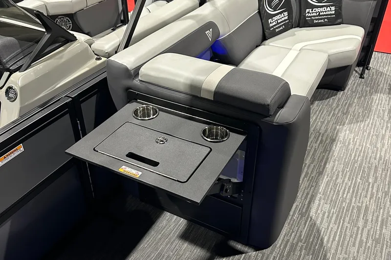 Slide: The Image of 2026 Viaggio Lago X22U boat interior with foldable table and cup holders. - 27