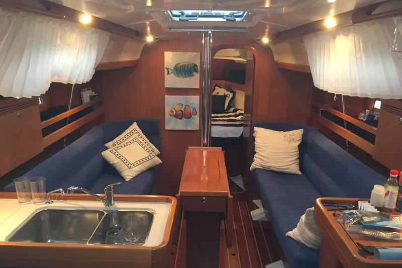 Slide: The Image of Interior of 2004 Dufour 34 Performance yacht with cozy seating and nautical decor. - 14