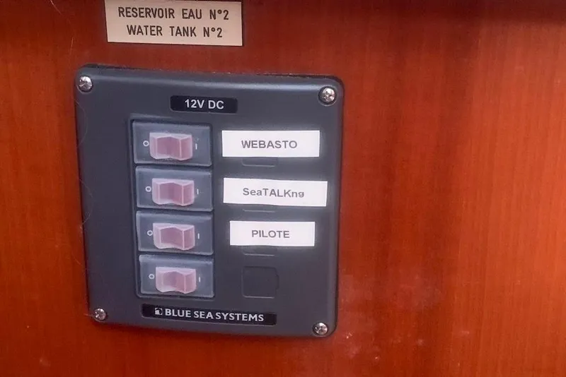 Slide: The Image of Control panel on 2004 Dufour 34 Performance yacht with labeled switches. - 25