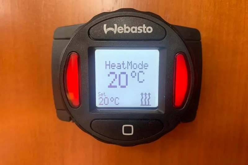 Slide: The Image of Webasto heater control displaying 20°C on a Dufour 34 Performance, 2004 model. - 31