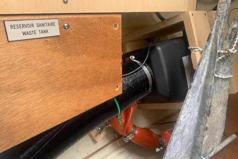 Slide: The Image of Waste tank system on a 2004 Dufour 34 Performance sailboat, featuring labeled components. - 35