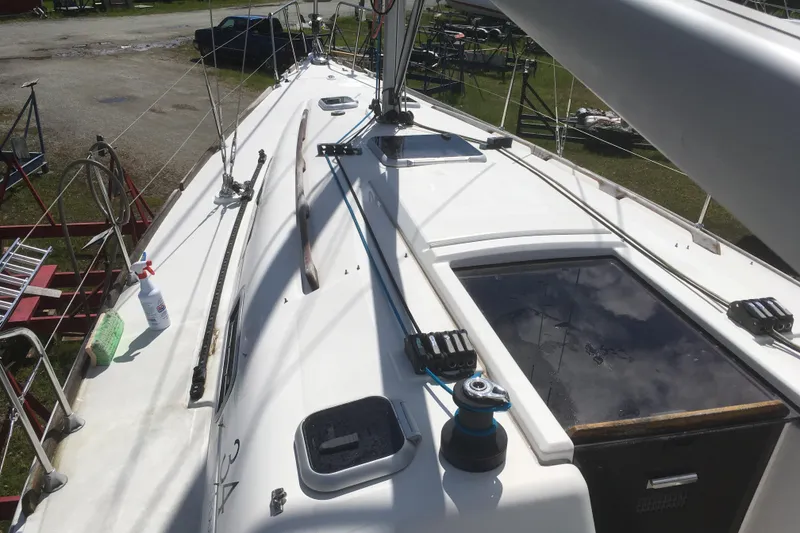 Slide: The Image of 2004 Dufour 34 Performance sailboat deck with winches and rigging. - 7