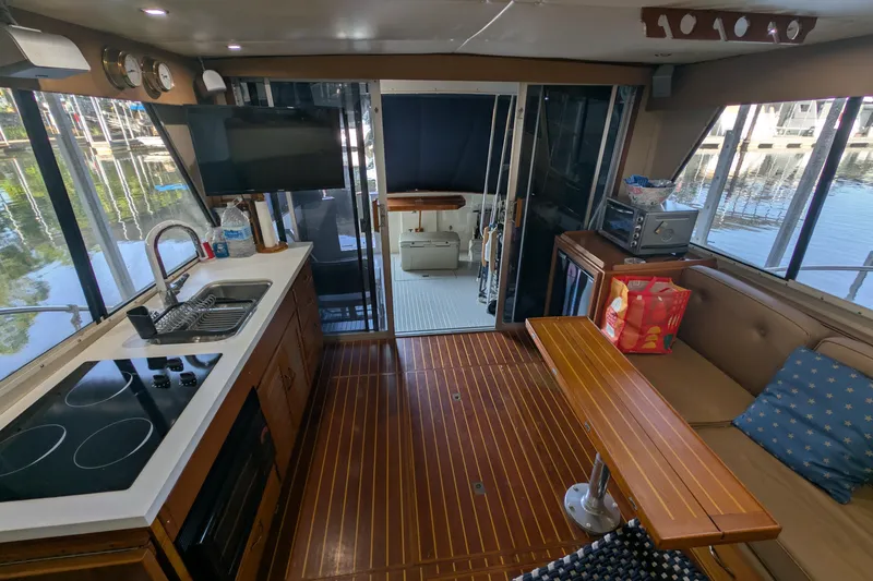Slide: The Image of Interior of 1975 Tollycraft 37 Sedan yacht with kitchen and seating area. - 22