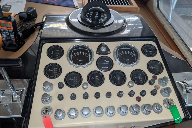 Slide: The Image of Control panel of a 1975 Tollycraft 37 Sedan boat with gauges and switches. - 31