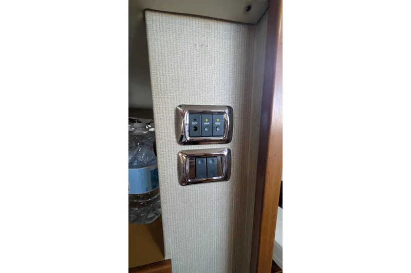 Slide: The Image of Switch panel on 1975 Tollycraft 37 Sedan boat interior. - 42