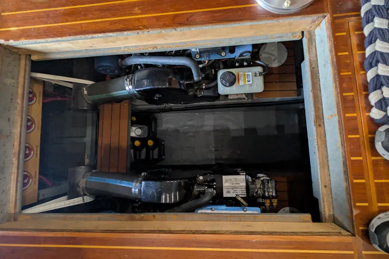 Slide: The Image of Engine compartment of a 1975 Tollycraft 37 Sedan with visible mechanical components. - 52