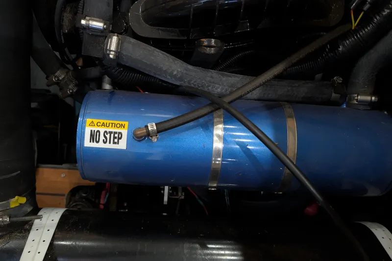 Slide: The Image of Engine compartment of a 1975 Tollycraft 37 Sedan with "No Step" caution label. - 55