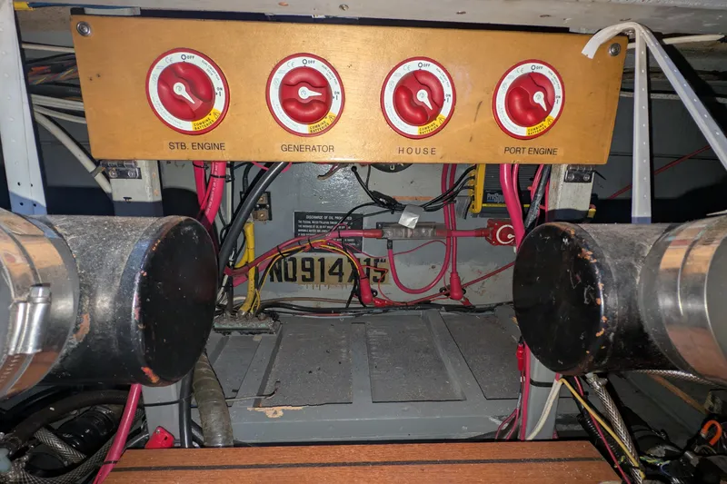 Slide: The Image of Electrical panel of a 1975 Tollycraft 37 Sedan with engine and generator switches. - 59