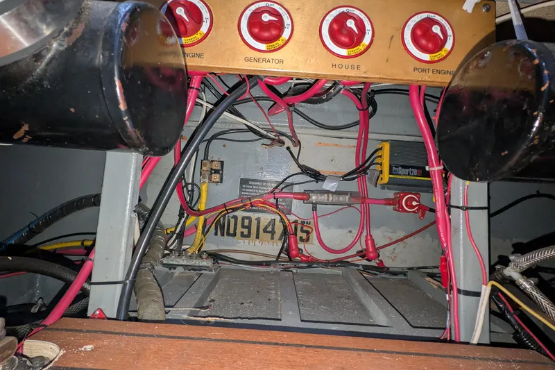Slide: The Image of Electrical panel of a 1975 Tollycraft 37 Sedan with wiring and switches. - 60