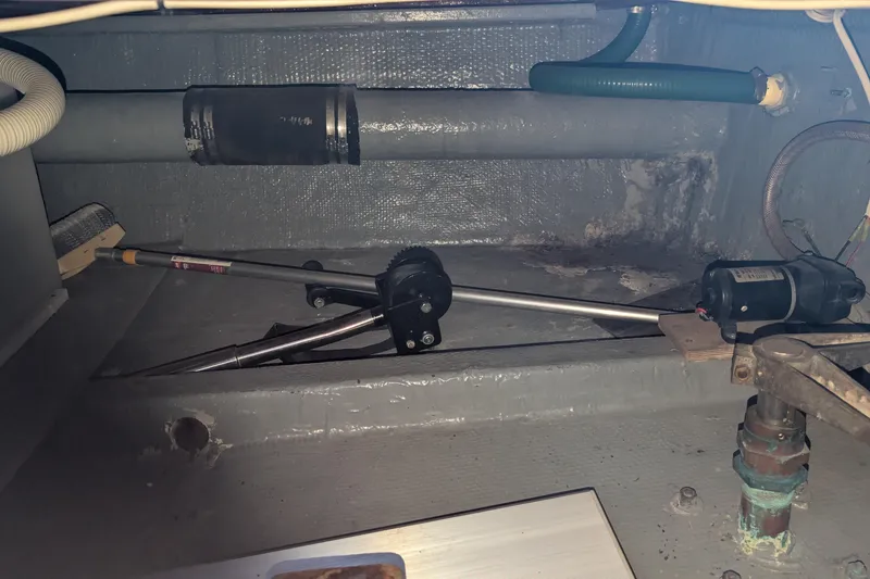 Slide: The Image of 1975 Tollycraft 37 Sedan engine compartment with mechanical components and wiring. - 63