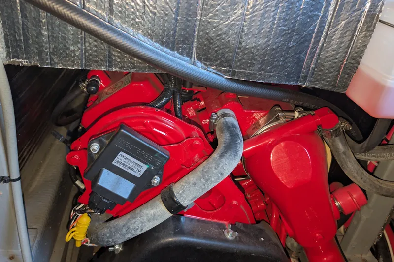 Slide: The Image of Engine compartment of a 1975 Tollycraft 37 Sedan with red components and insulation. - 64