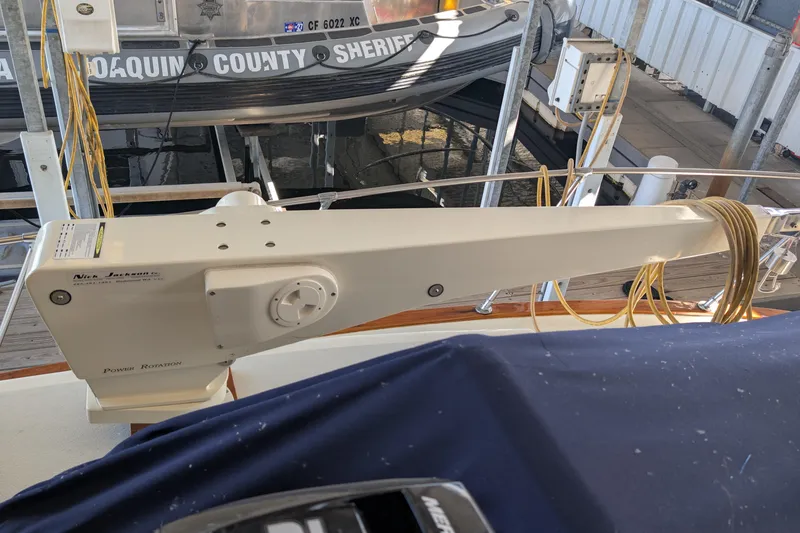 Slide: The Image of 1975 Tollycraft 37 Sedan with Nick Jackson power rotation davit on deck. - 70