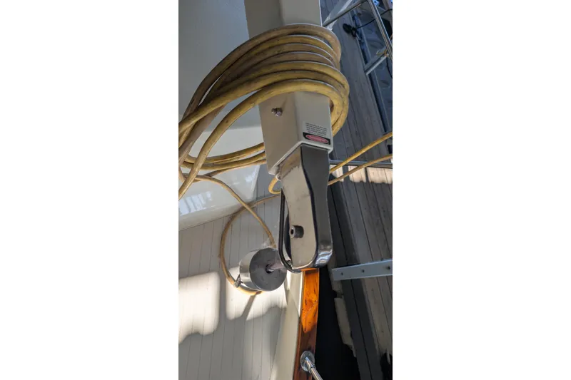 Slide: The Image of Close-up of a 1975 Tollycraft 37 Sedan boat's deck with coiled rope. - 72