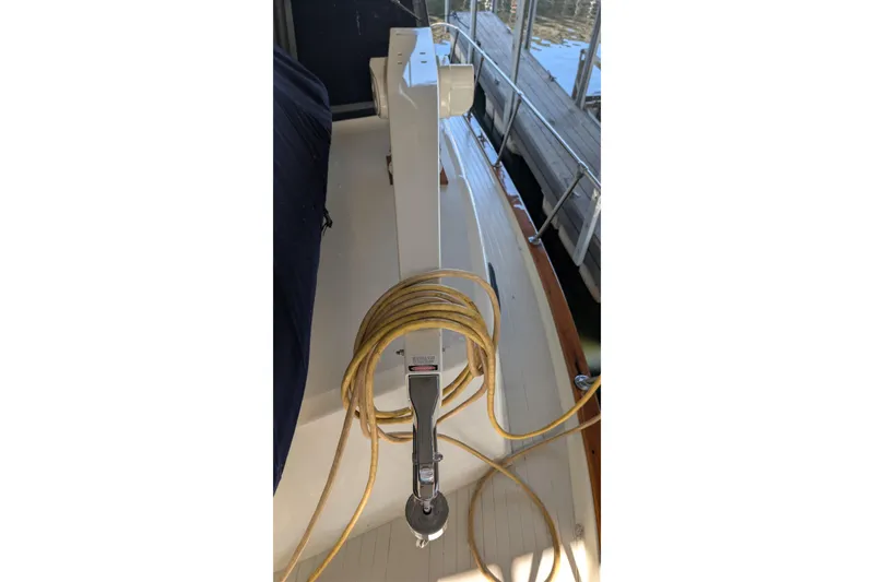 Slide: The Image of 1975 Tollycraft 37 Sedan deck with coiled rope and dock view. - 73