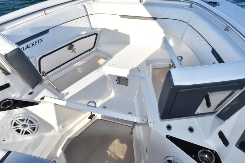 Slide: The Image of 2022 Blackfin 272 CC boat interior with seating and storage compartments. - 10