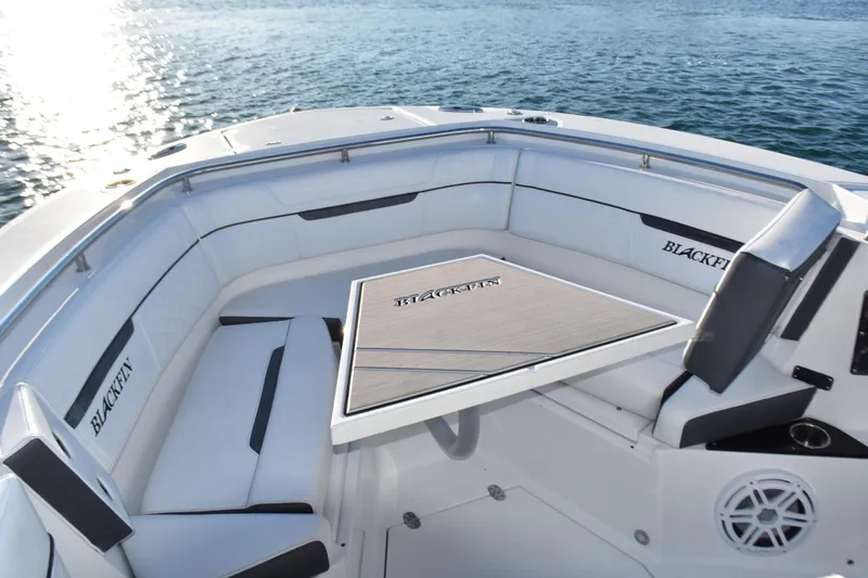 Slide: The Image of Luxurious seating area on 2022 Blackfin 272 CC boat, featuring elegant design and ocean view. - 9