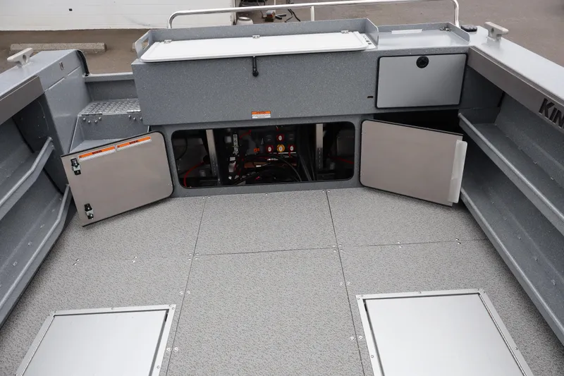 Slide: The Image of Interior view of 2026 KingFisher 2825 Coastal Express boat, showcasing storage compartments and deck layout. - 10