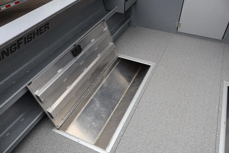 Slide: The Image of Interior view of 2026 KingFisher 2825 Coastal Express boat with open storage compartment. - 12