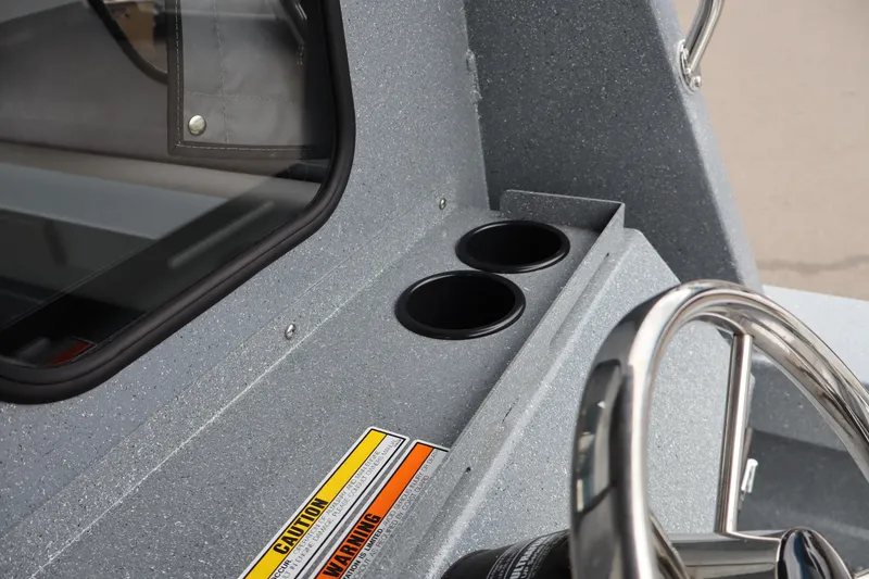 Slide: The Image of 2026 KingFisher 2825 Coastal Express dashboard with steering wheel and cup holders. - 16