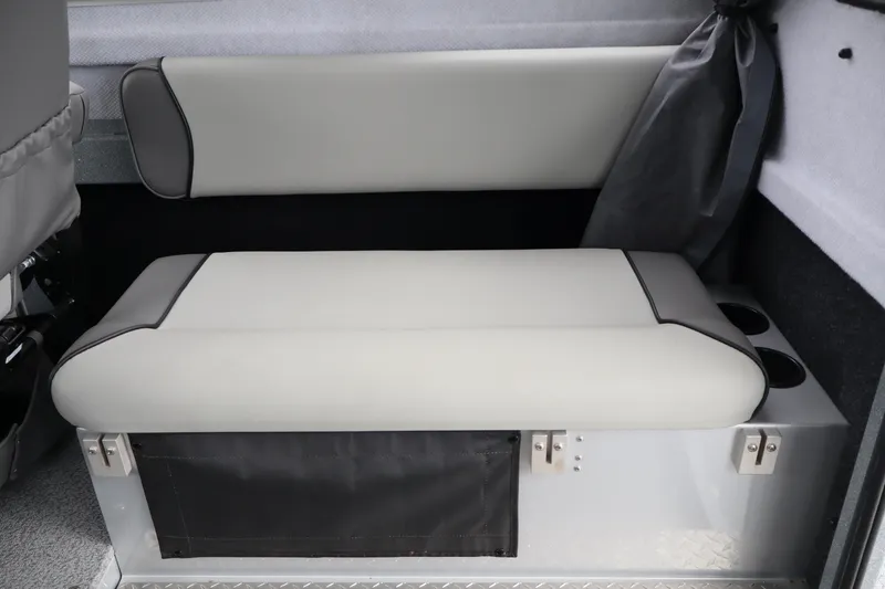Slide: The Image of 2026 KingFisher 2825 Coastal Express interior seating with storage and cup holders. - 21