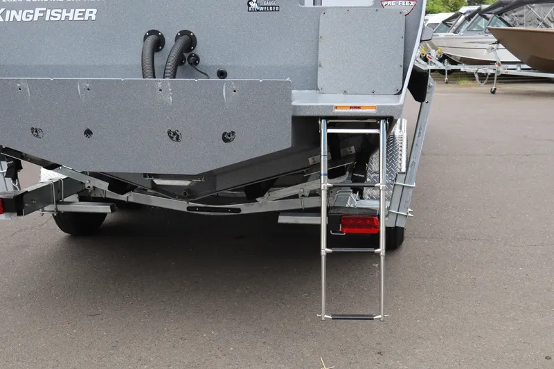 Slide: The Image of Rear view of 2026 KingFisher 2825 Coastal Express boat with ladder and trailer. - 5