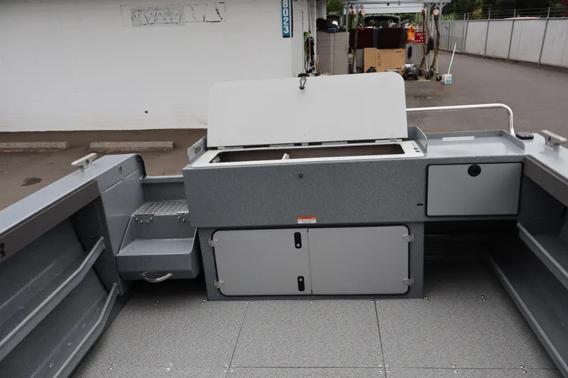 Slide: The Image of 2026 KingFisher 2825 Coastal Express boat interior with storage compartments and seating. - 7