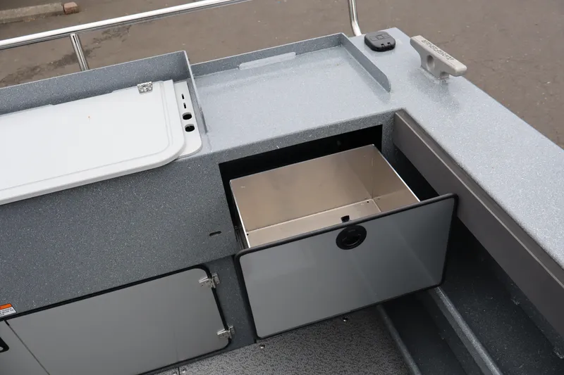 Slide: The Image of Storage compartment on 2026 KingFisher 2825 Coastal Express boat, featuring sleek design and functionality. - 9